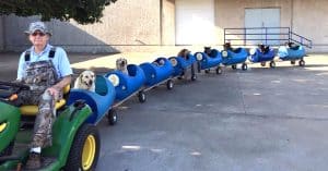 82-Year-Old Retired Man Finds A New Calling And Builds A Dog Train For Foster Dogs